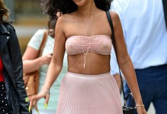 Rihanna in American Apparel Stretch Floral Lace Ruched Front Tube Bra pink Topshop Pleated Dip Back Skirt body chain yellow talon nails black Celine Nano Luggage Bag sunglasses black hi-top Converse Chuck Taylors