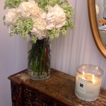 Rachel Roy showroom flowers candle