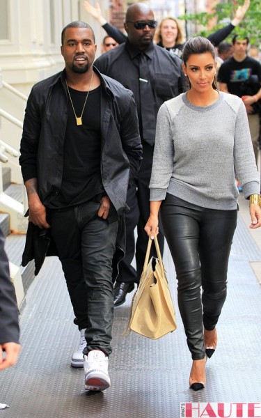 Kanye West and Kim Kardashian in H&M grey sweatshirt Celine taupe leather 'Luggage Phantom' square tote leather leggings Christian Louboutin Unbout Illusion Slingback pumps