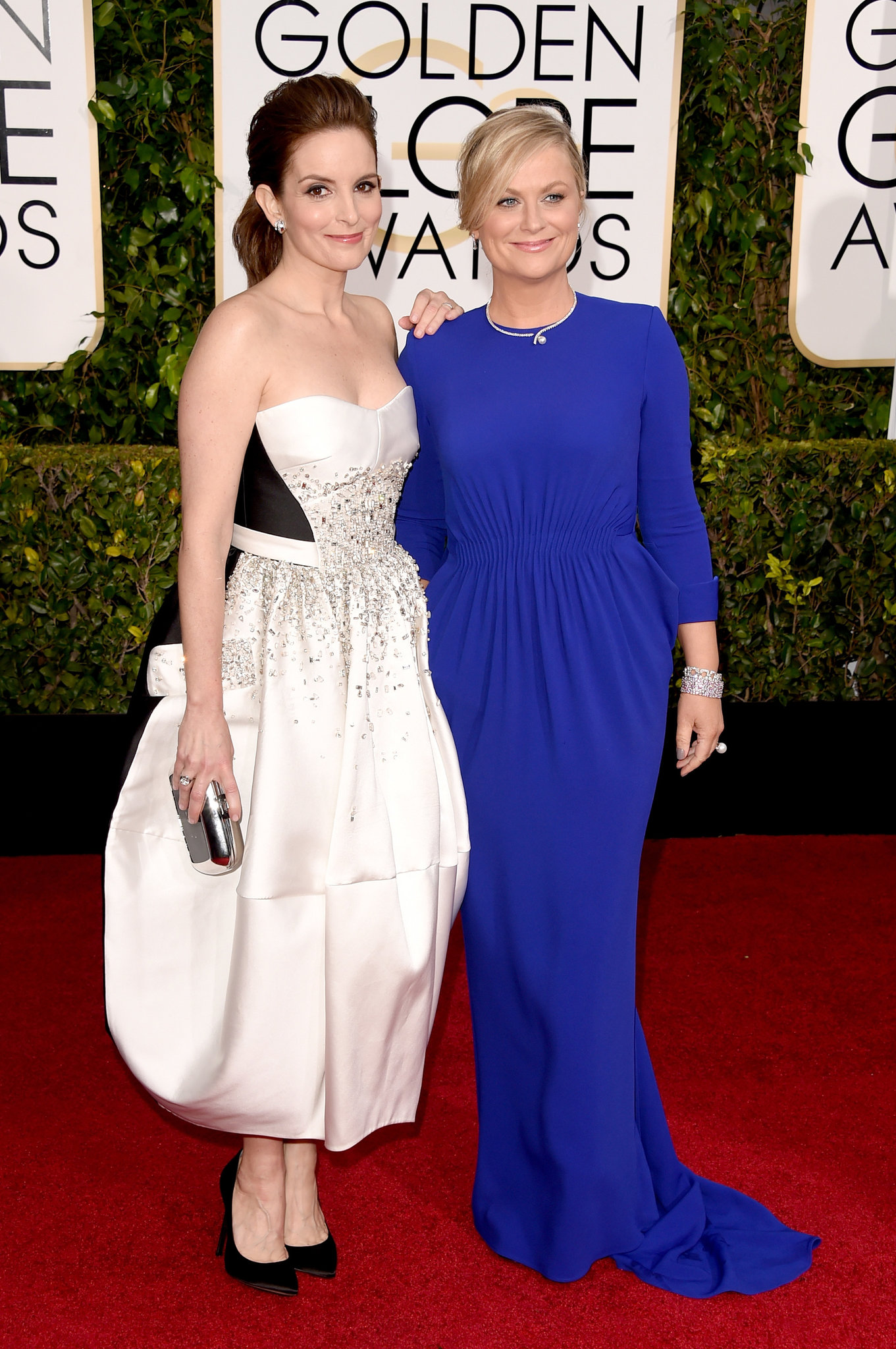 Tina Fey in Antonio Berardi and Amy Poehler in Stella McCartney - What