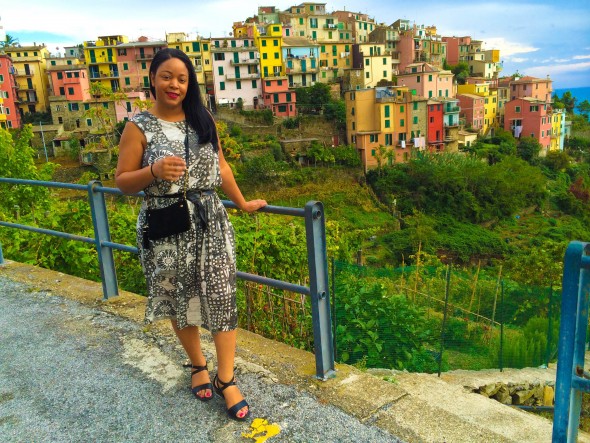 Wearing a printed sundress from & Other Stories in Cinque Terre